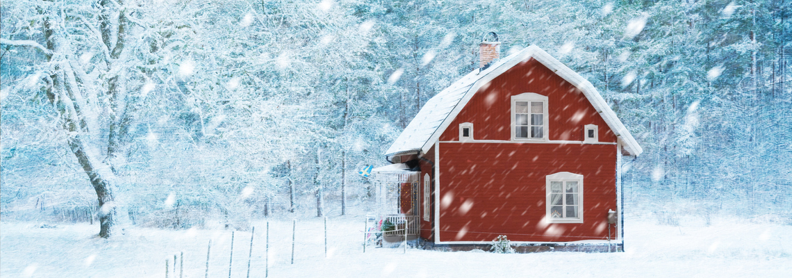 A red cabin in snowfall