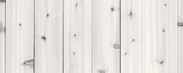 Pale light gray wood background of wooden planks showing woodgrain texture. Foto: Elena Elisseeva