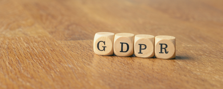 GDPR concept image with small wooden dices on a wooden background. Foto: Andreas Berheide